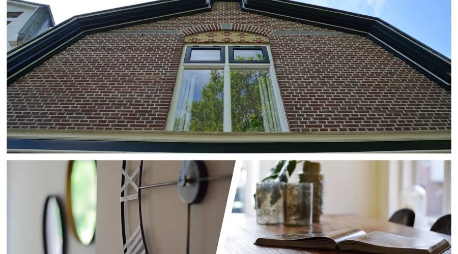 Een foto van een huis met een klok erop.